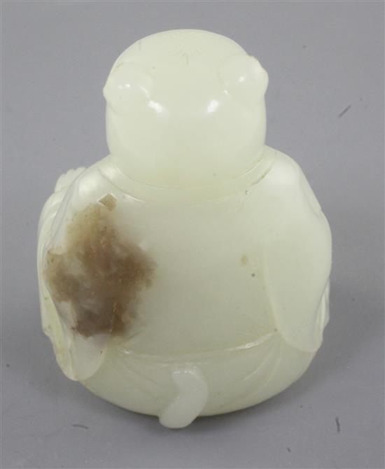 A Chinese pale celadon jade tiger-headed figure of a man, 18th / 19th century., height 5.2cm, tiny chips